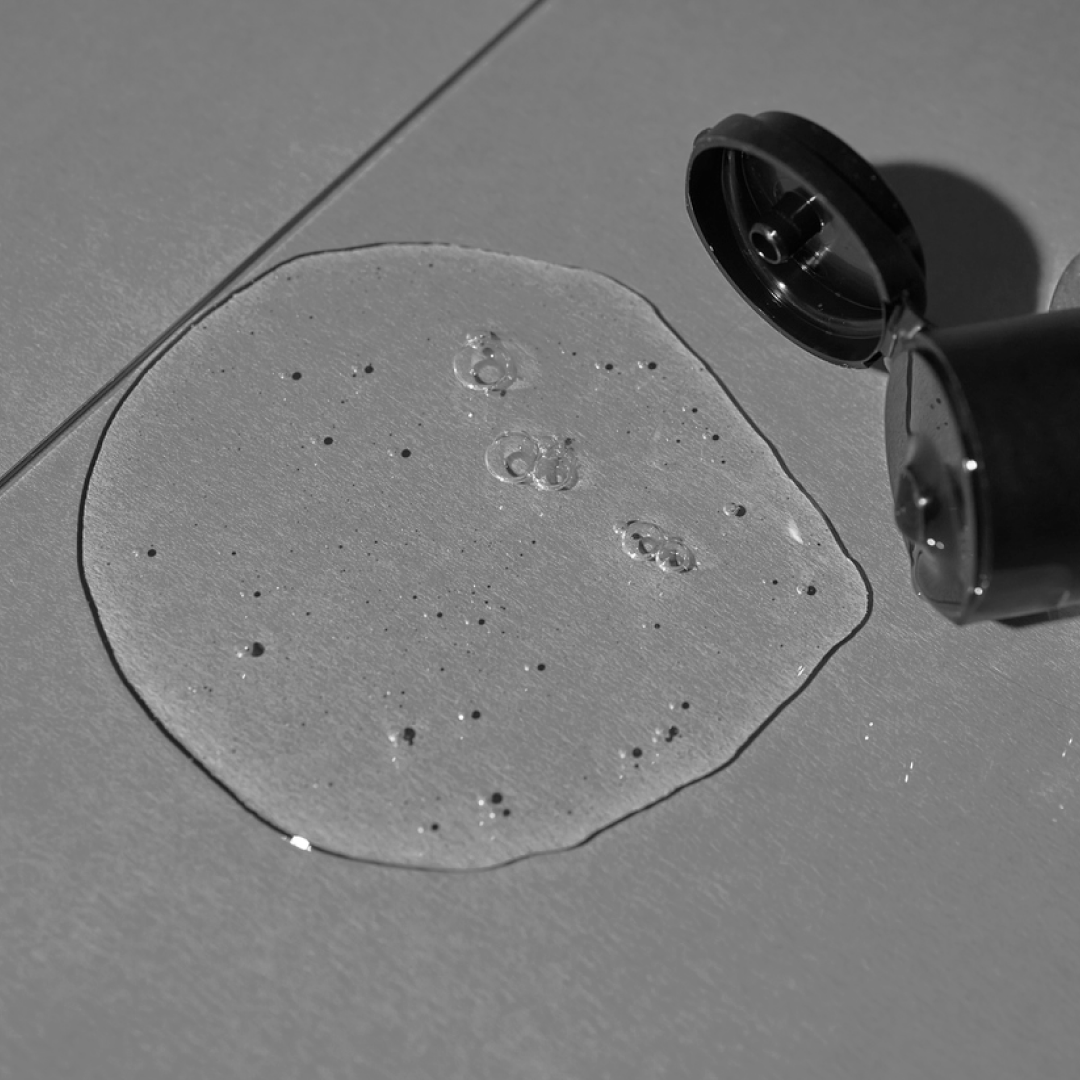 A single green leaf against a white background.