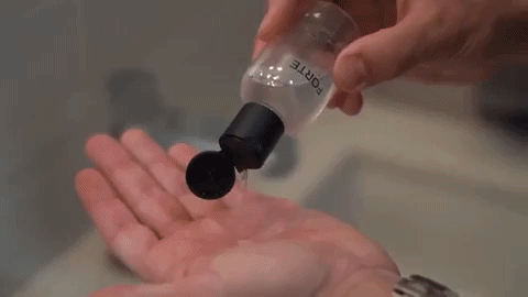 A single green leaf against a white background.