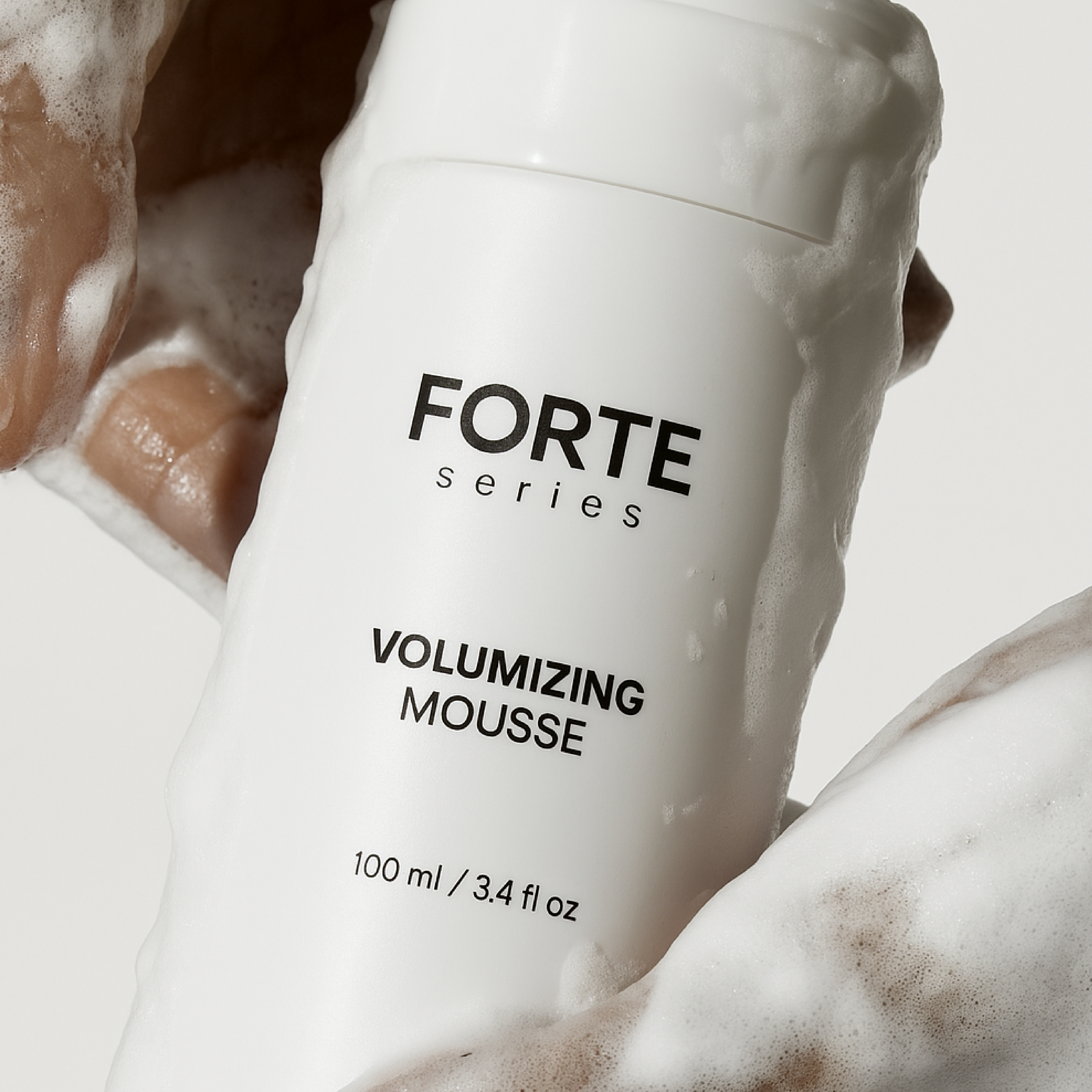 A single green leaf against a white background.