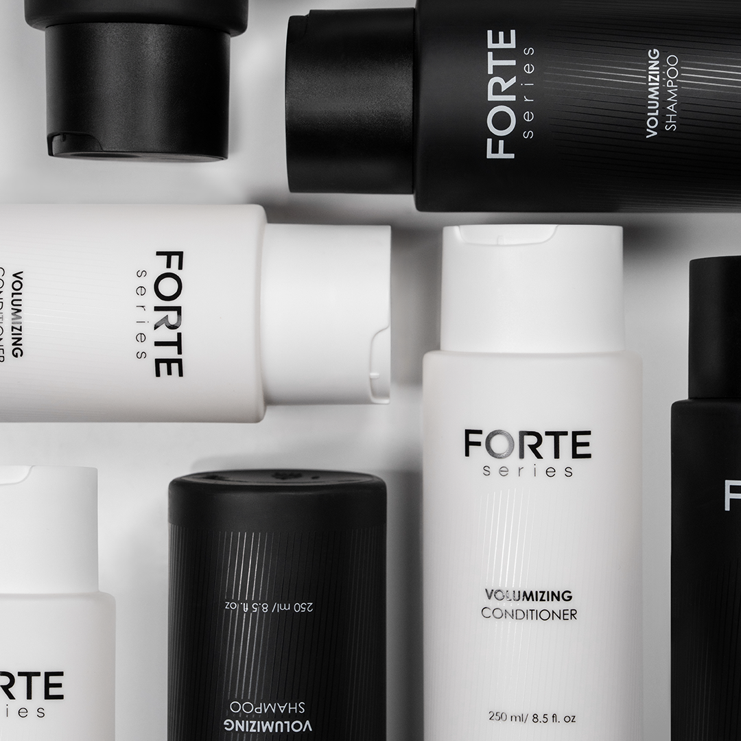 A single green leaf against a white background.