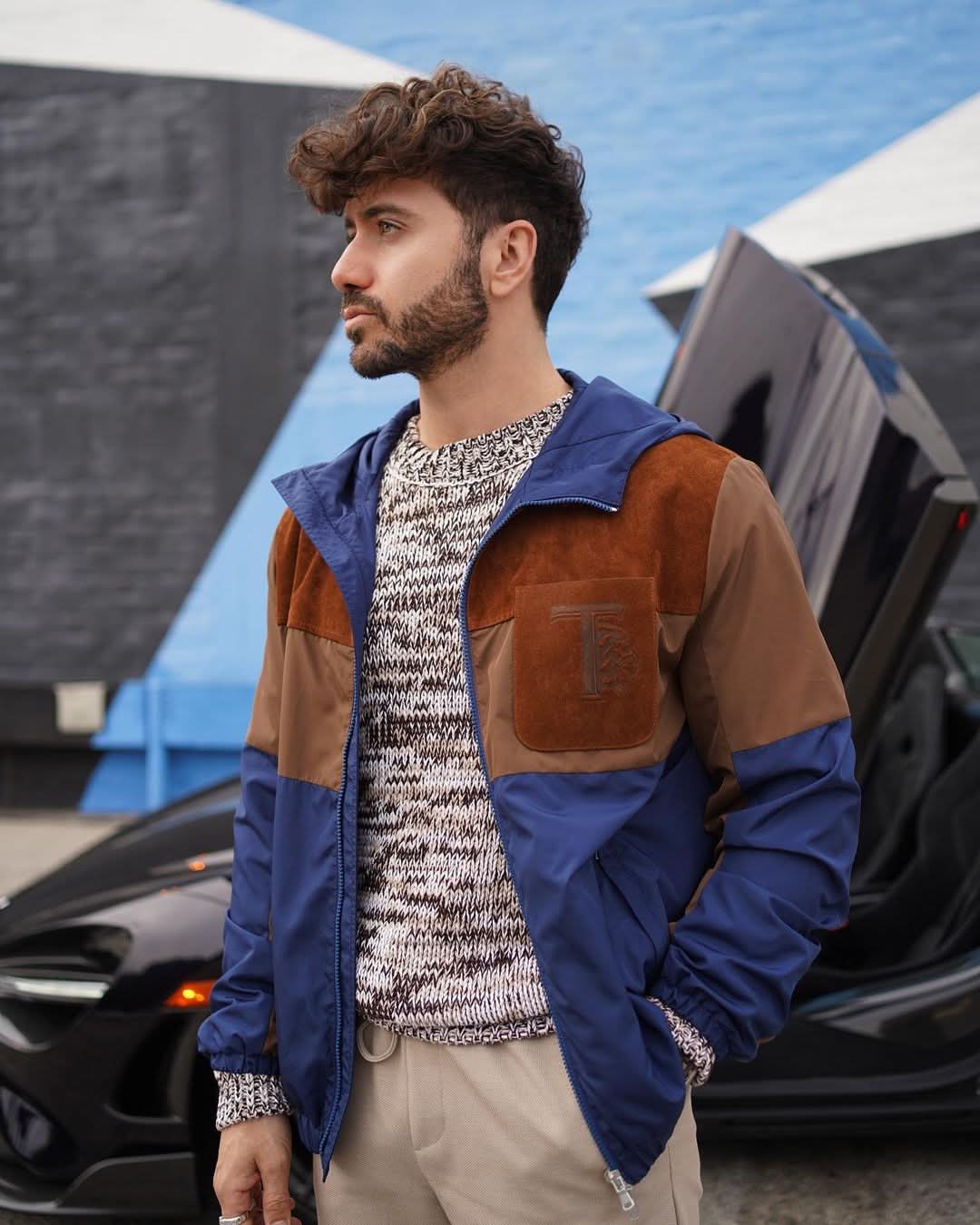 A single green leaf against a white background.