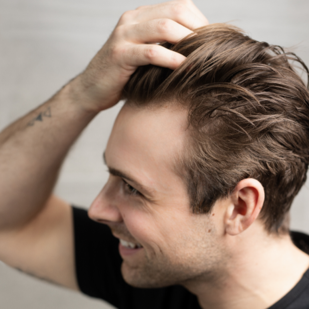 A single green leaf against a white background.