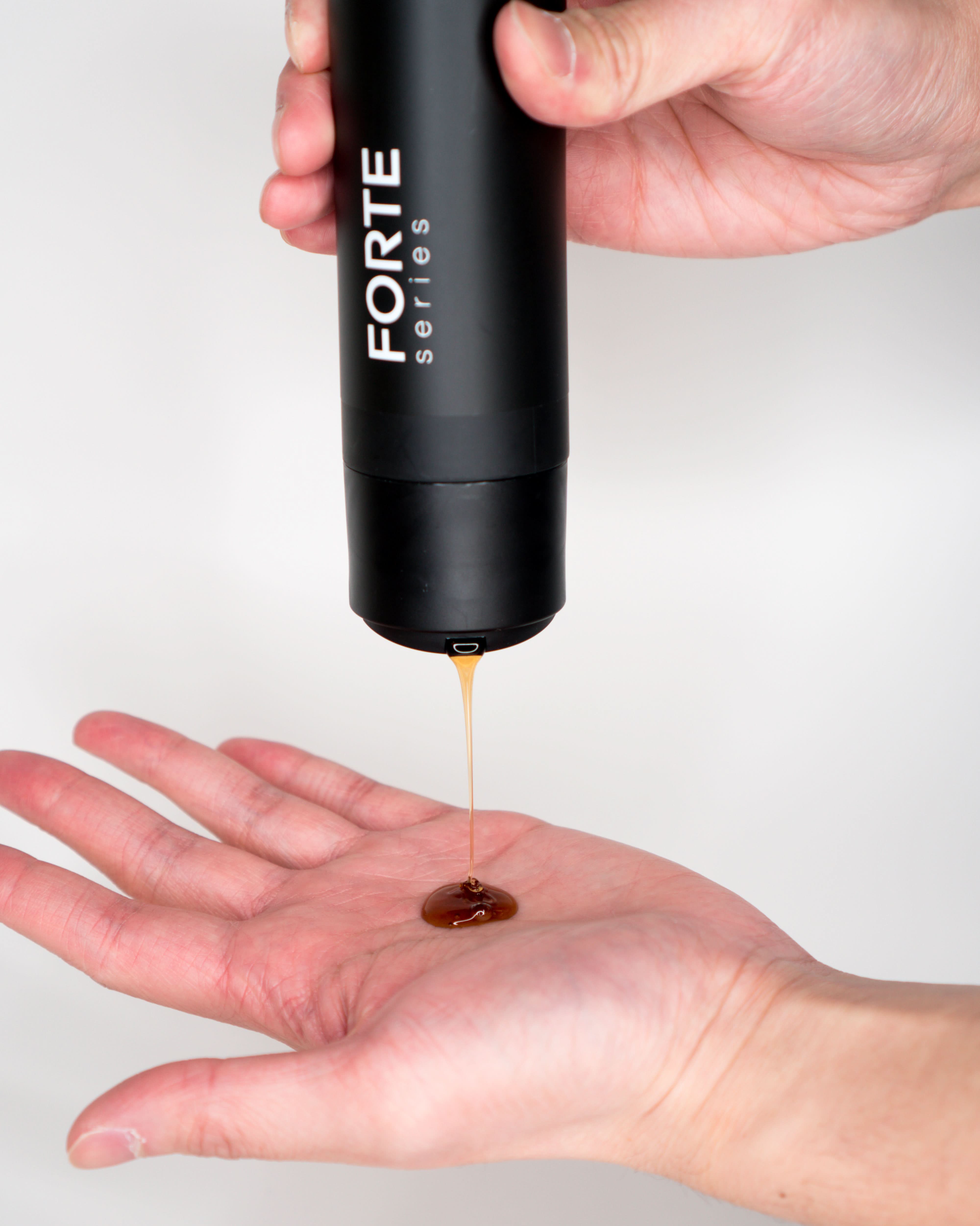 A single green leaf against a white background.
