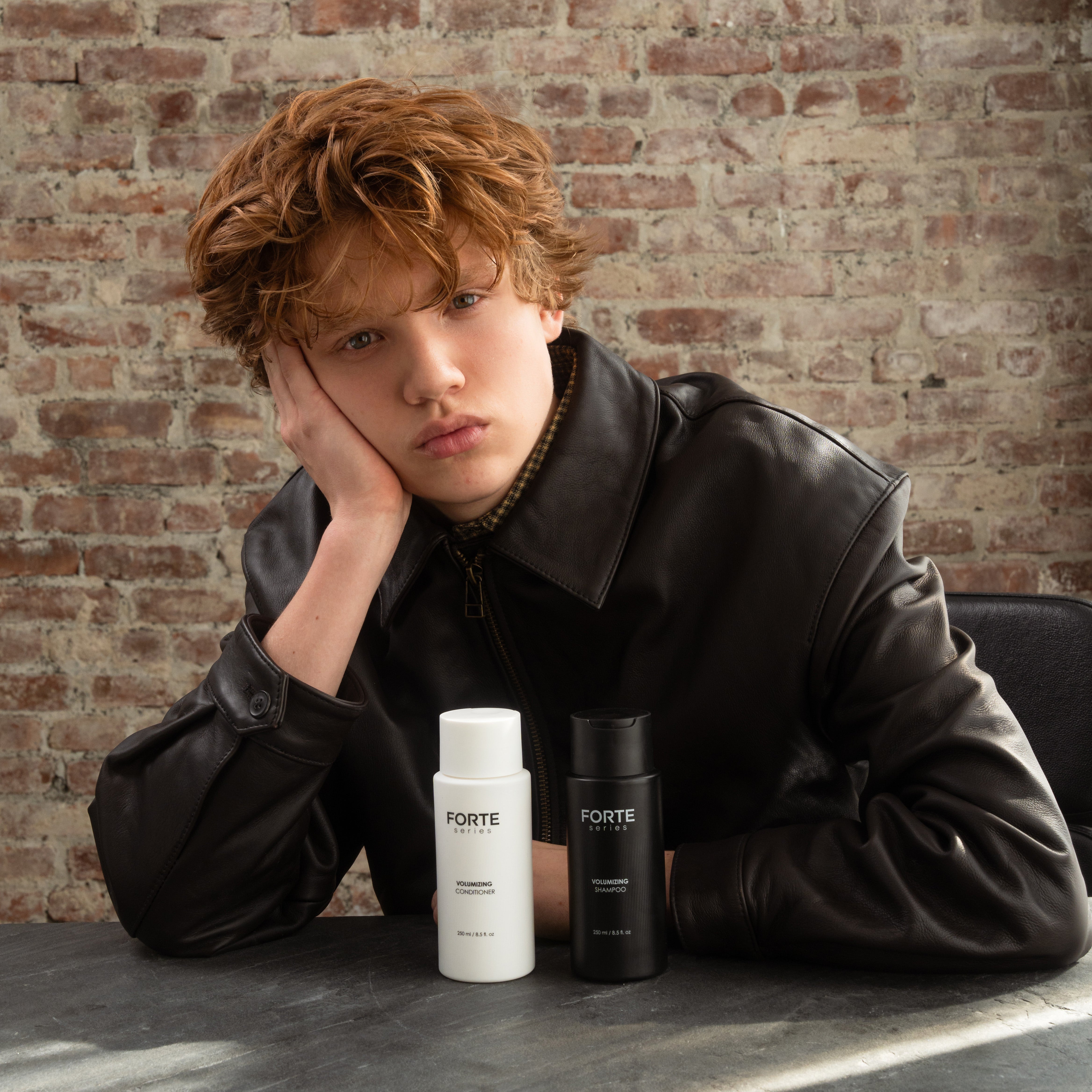 A single green leaf against a white background.
